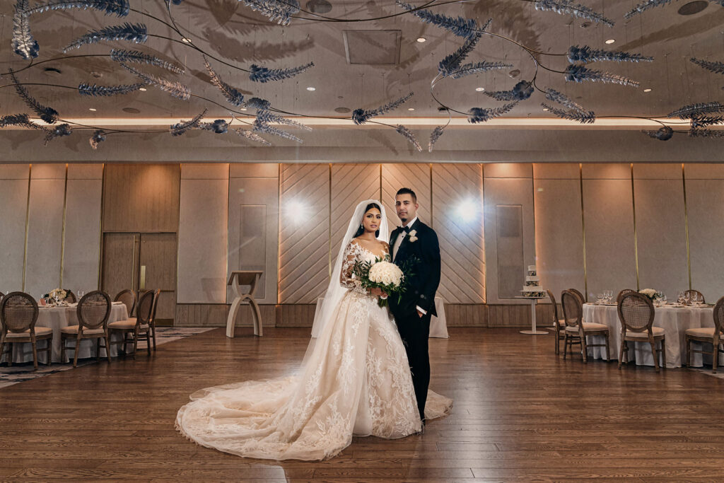 Newlywed portrait in their reception room at The Pearle Hotel
