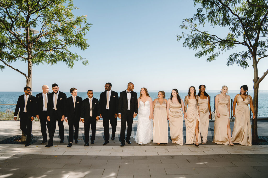 Bridal party walking outside The Pearle Hotel