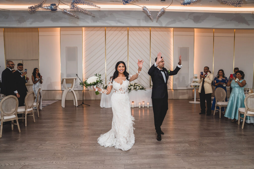 newlyweds entering their wedding reception at The Pearle Hotel