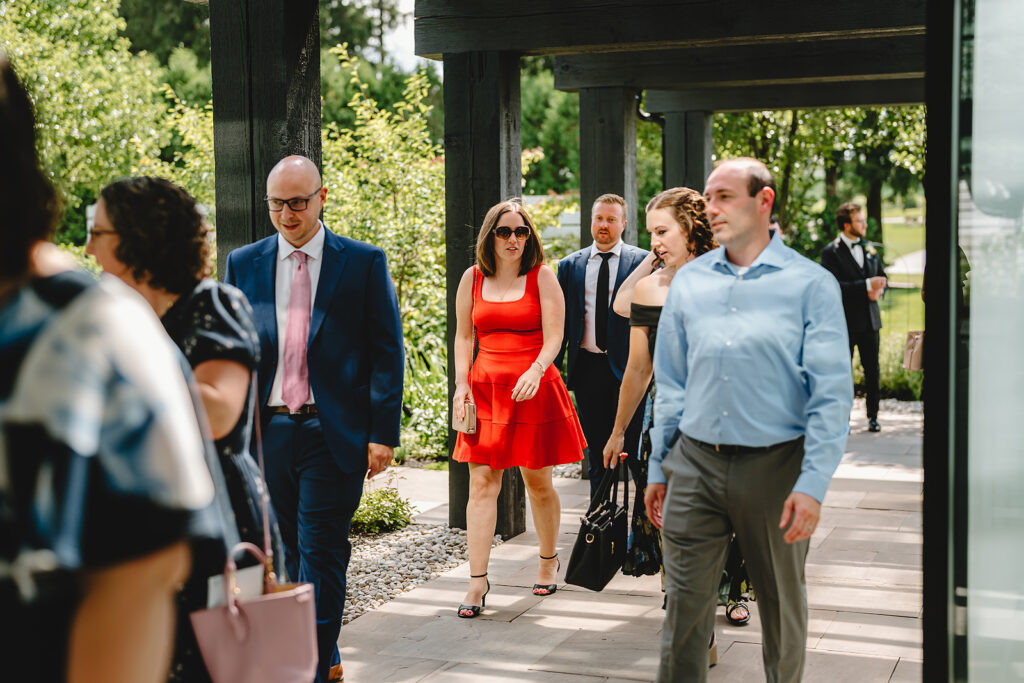 Guests arriving for a wedding in the garden chapel at Whistle Bear, Cambridge, Ontario