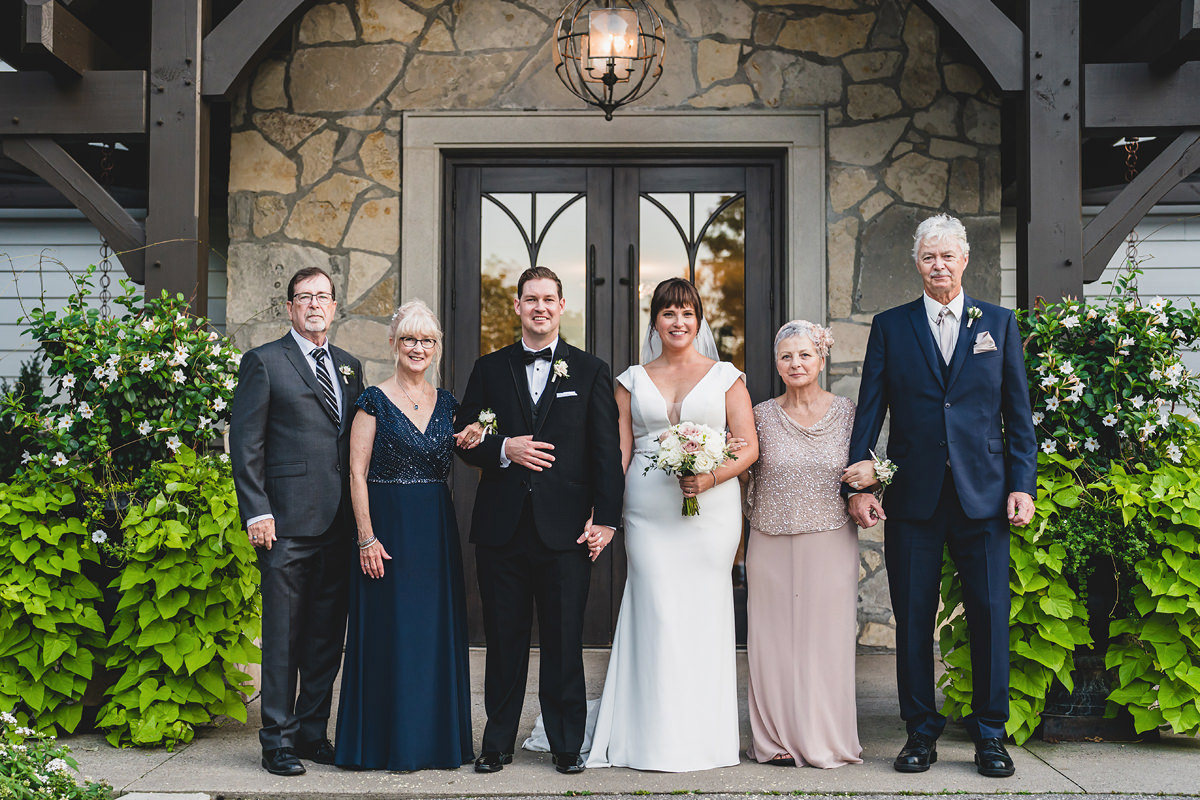 Formal family photos outside the indoor chapel at Ancaster Mill