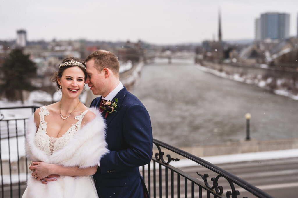 Newlyweds on the Juliet balcony at Cambridge Mill