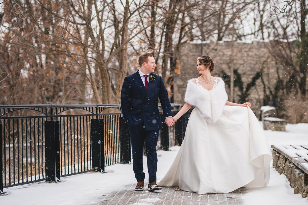 Newlyweds walking together at Cambridge Mill