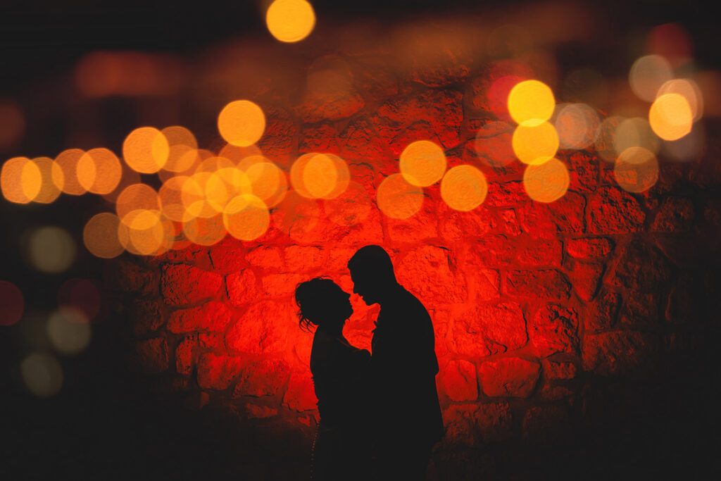 A night time silhouette of newlyweds at Cambridge Mill