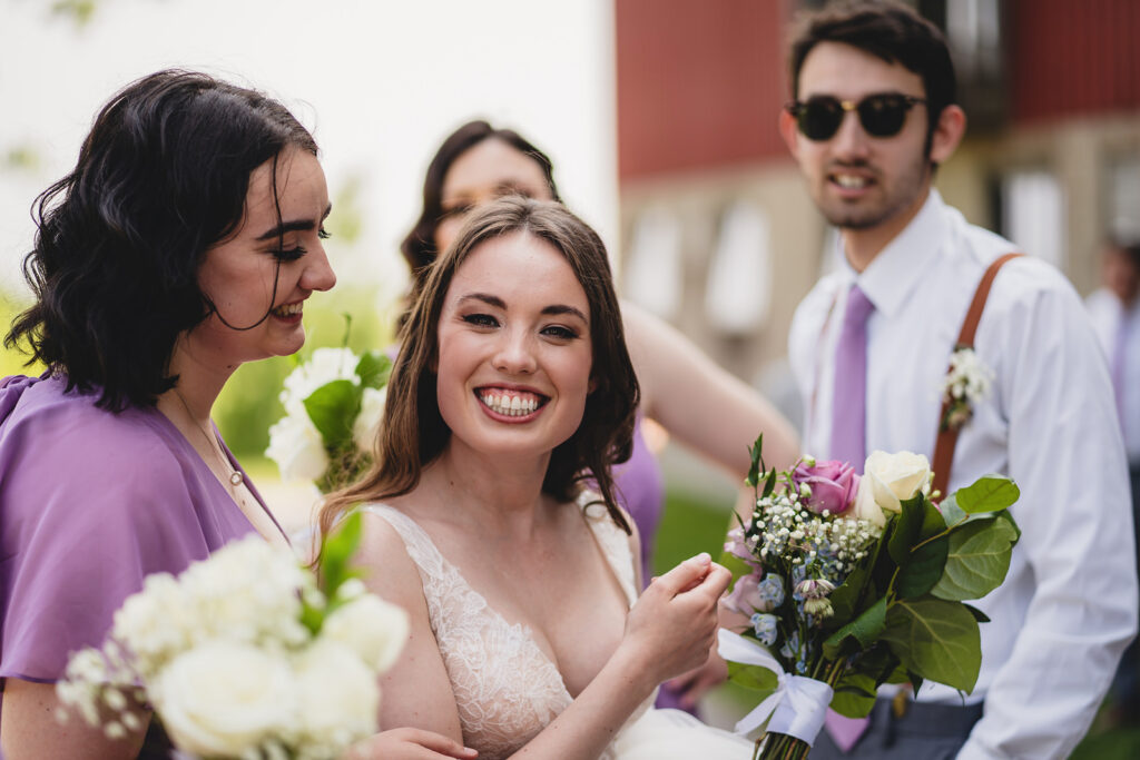 A smiling bride on her wedding day at The Earth to Table Farm wedding venue