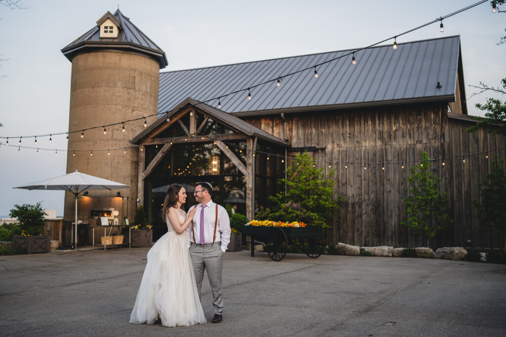 Newlyweds sharing a quiet of moment to themselves at The Earth to Table Farm wedding venue