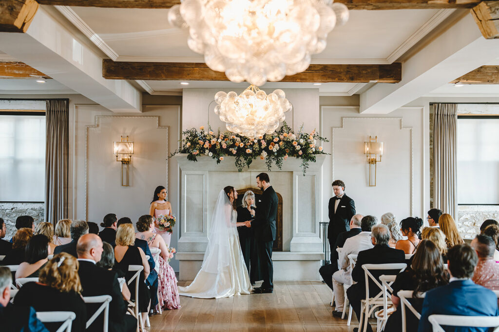 A Bride and Groom saying their vows at Elora Mill