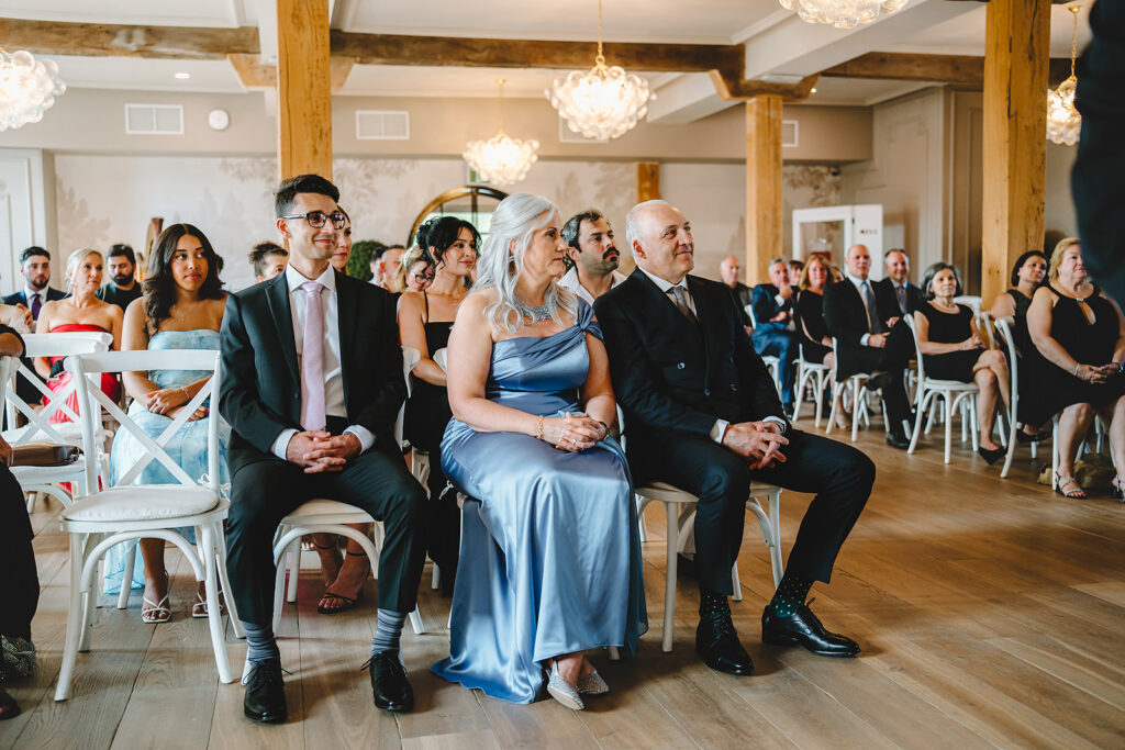 Parents watching the wedding ceremony at Elora Mill, Elora