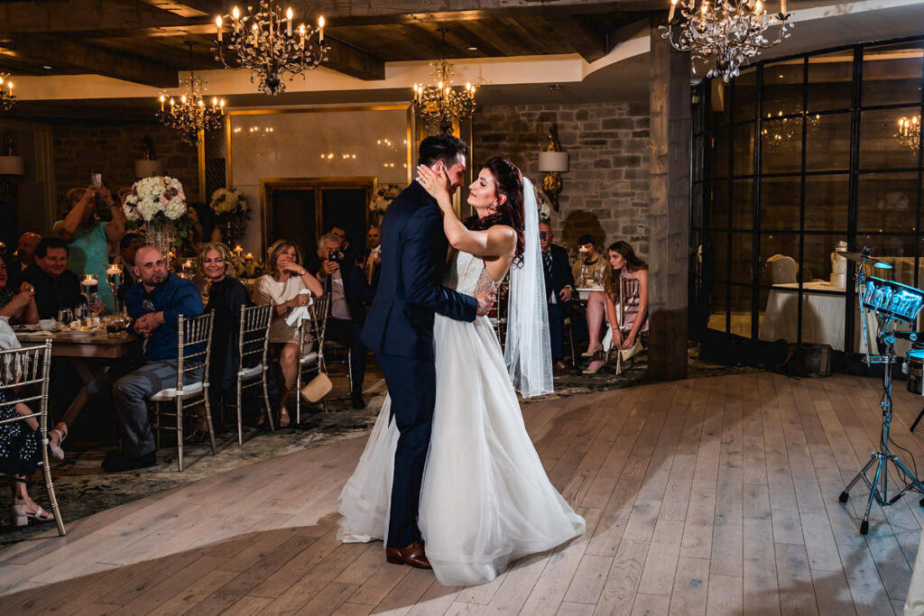 Newlyweds sharing their first dance at Elora Mill