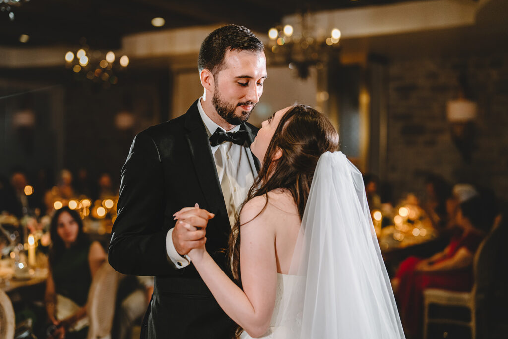 A bride and groom during their first dance at Elora Mill
