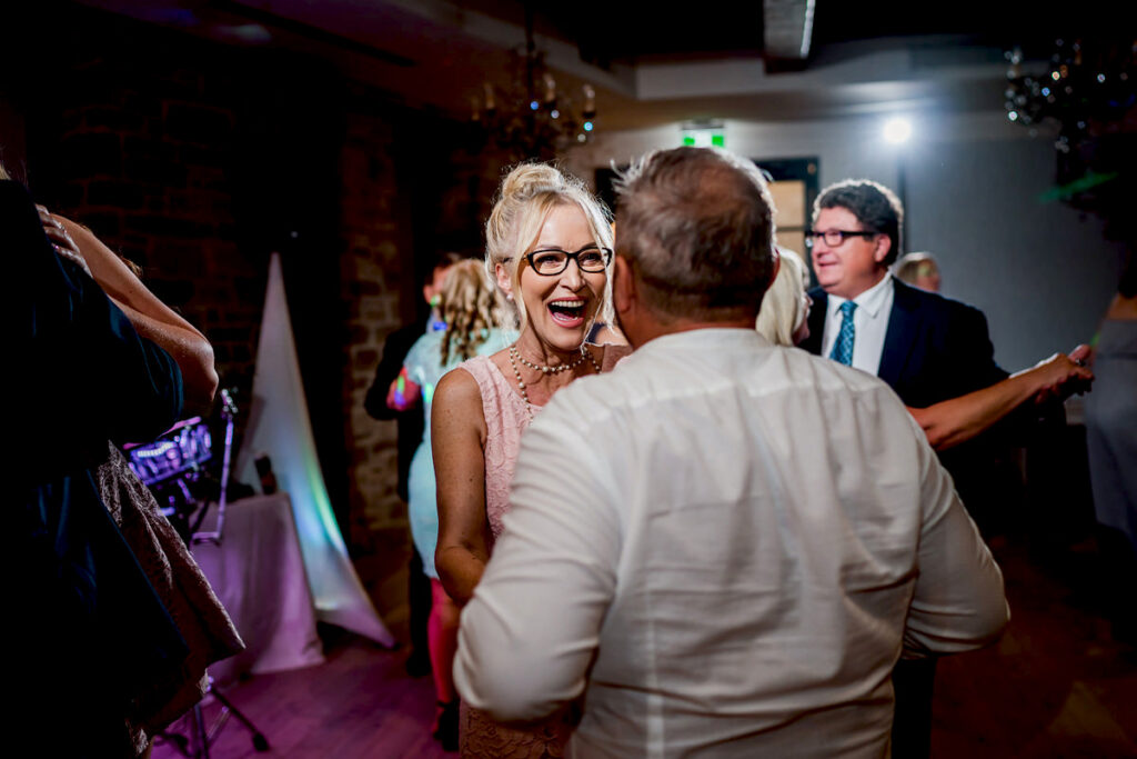 Guests celebrating on the dance floor at Elora Mill