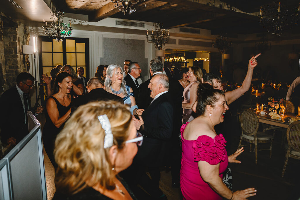 A packed dance floor at a Elora Mill wedding