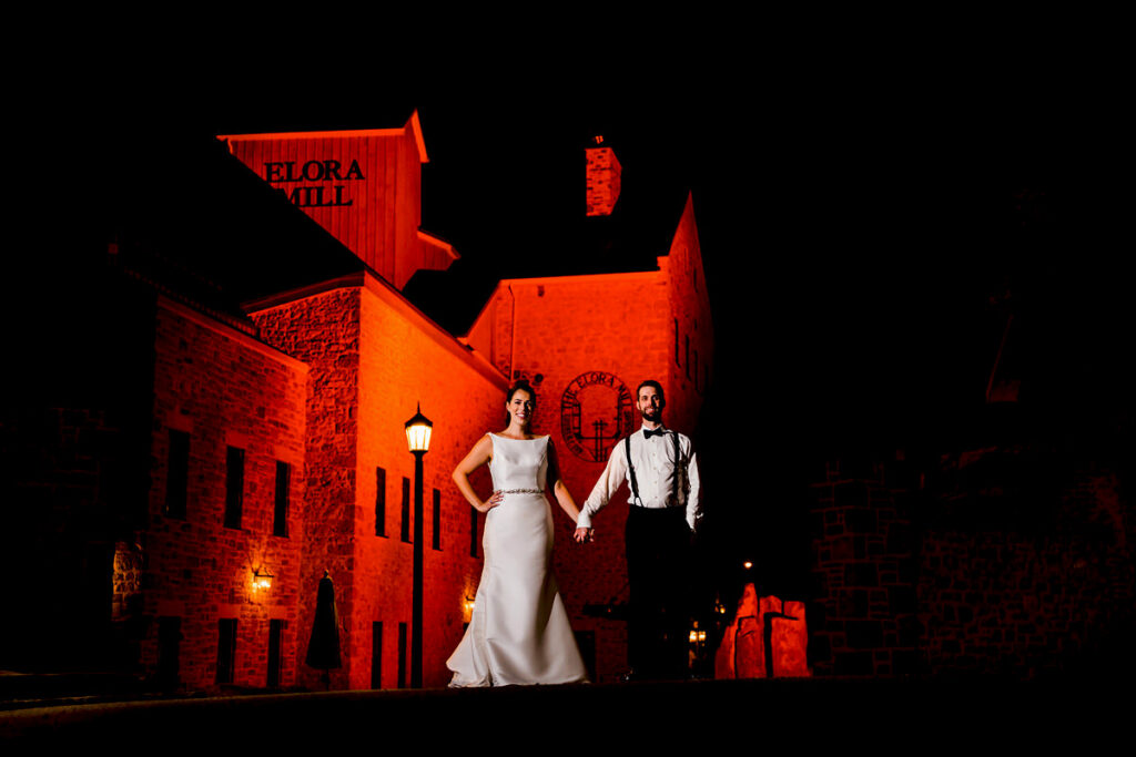 Late night off camera flash portrait of newlyweds at Elora Mill