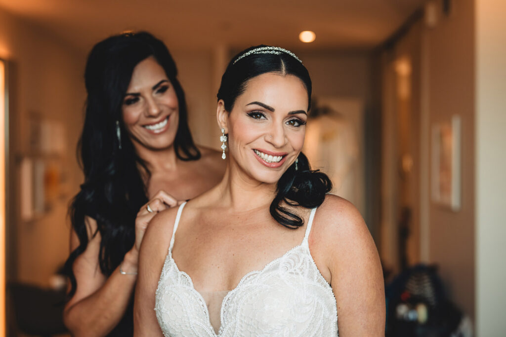 A smiling bride before her wedding at Spencer's at the Waterfront