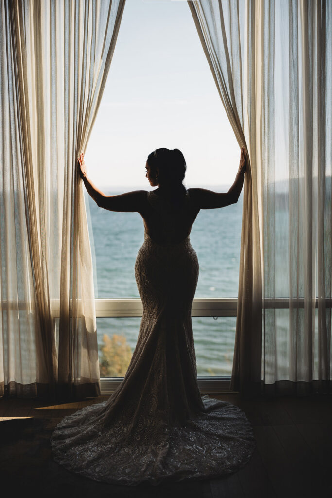 A bride getting ready at The Pearle Hotel before the wedding at Spencer's at the Waterfront