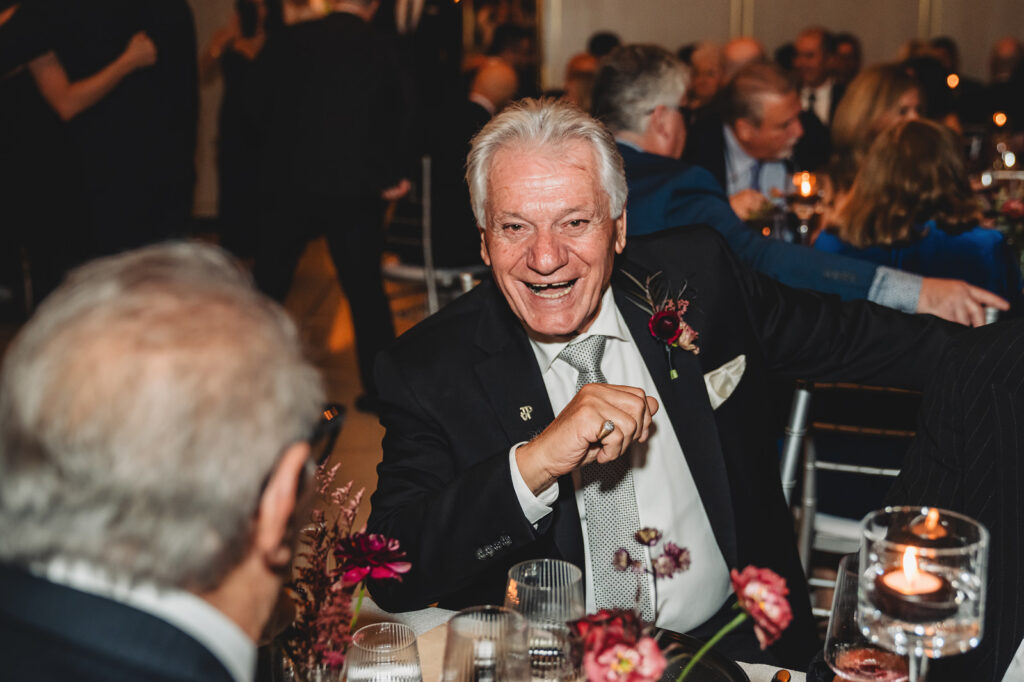 Guest laughing during speeches at a Spencer's at the Waterfront wedding